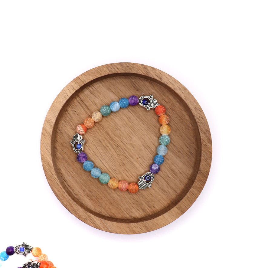 7 chakra bracelet made with cracked agate beads and fatima hand (hand of hamsa) charms